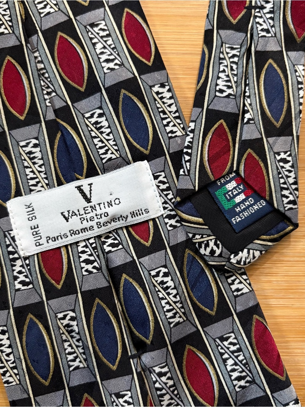 Valentino Silk Tie in Black with Red, Navy and Gold Accents